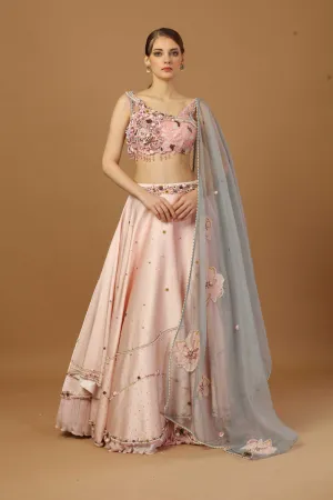 Assymetric Lehenga With Strap Blouse And A Organza Dupatta.